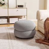 Donut-shaped pouf in boucle fabric pouf ottoman and pouf seat, round silhouette in grey.